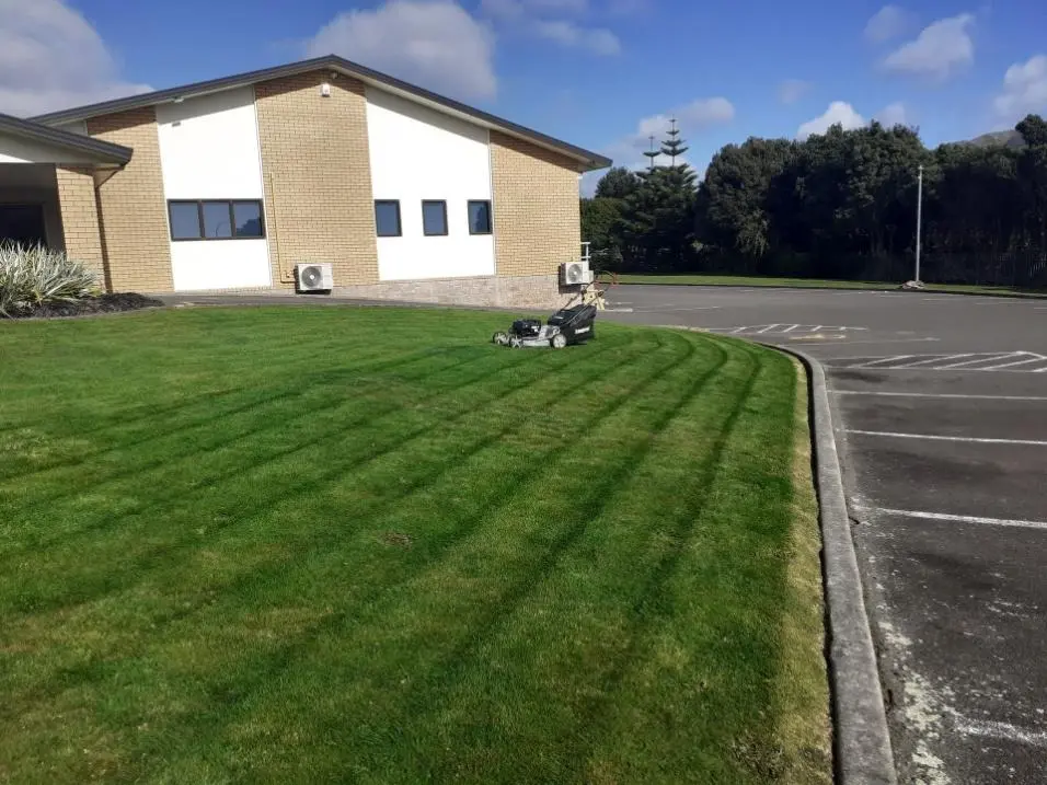Freshly striped lawn mowed by SJ Lawns in Porirua